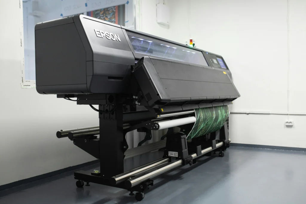 Epson printer printing photos on glossy paper in a professional photo studio