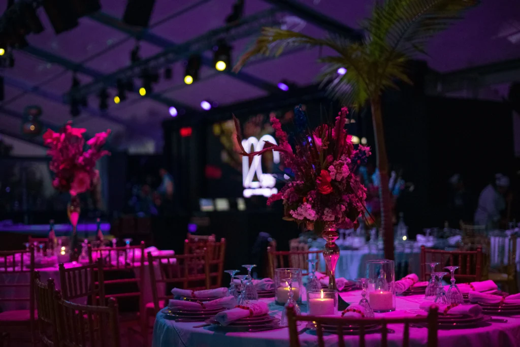 Well-organized and fully prepared event venue with neatly arranged tables, decorations, and seating setup.