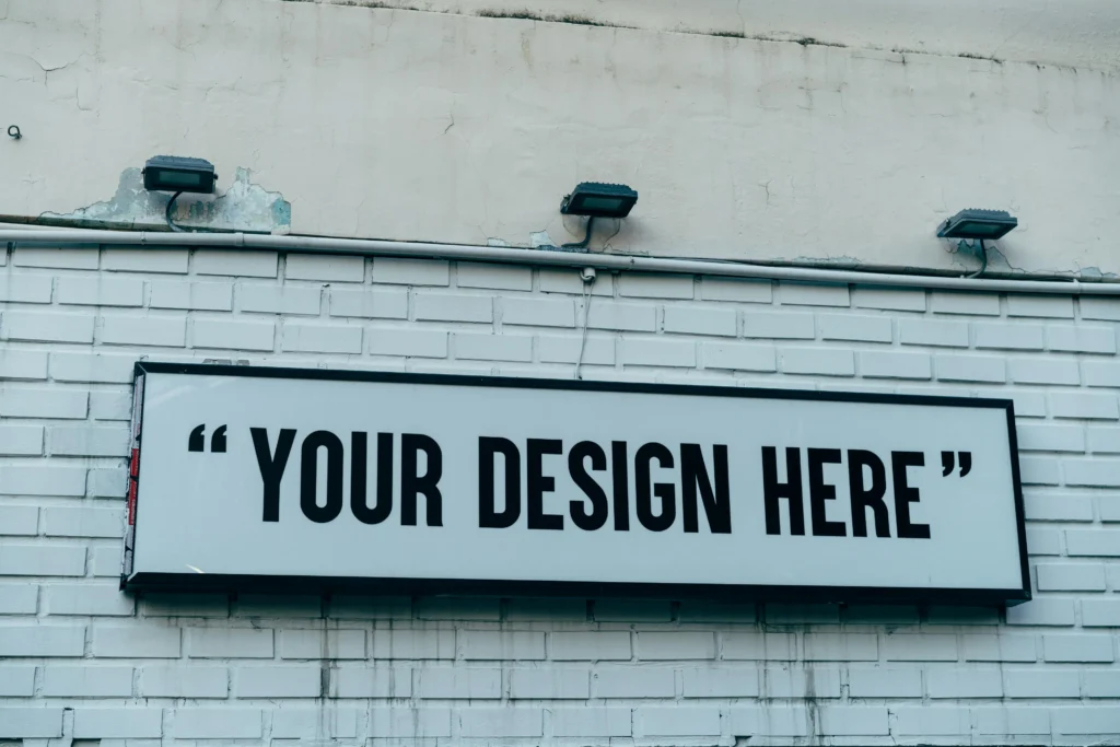 Blank signage template displaying “Your Design Here” in a print studio