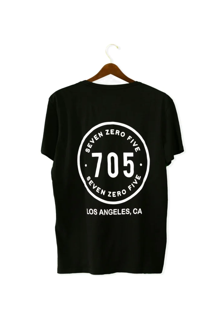 Black custom t-shirt with professionally printed text design on the front.