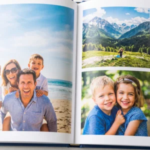Customizable hardcover photo book with personalized cover and photo layouts, displayed open to showcase vibrant printed memories.